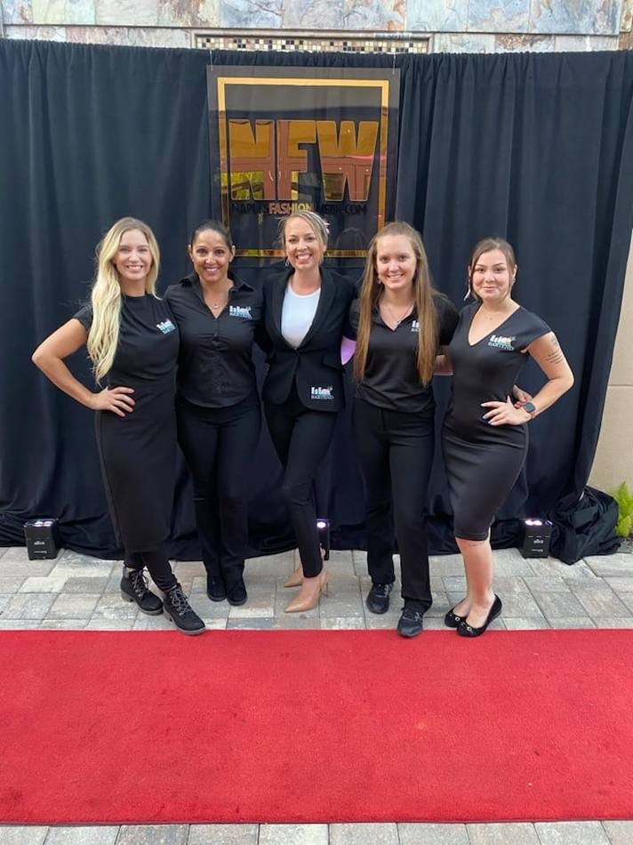 ISLE Bartend team member serving guests at an event bar