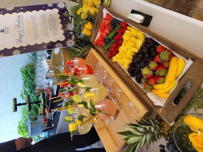 Cocktails, fresh fruit and branded service setup