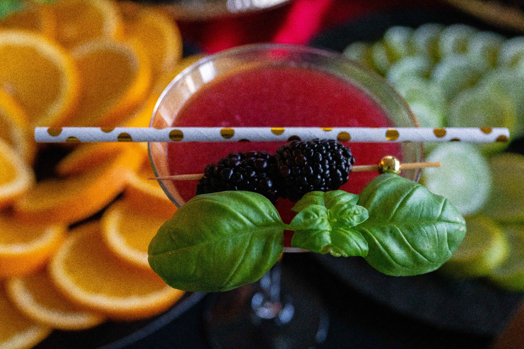 Fresh berry cocktail with basil garnish